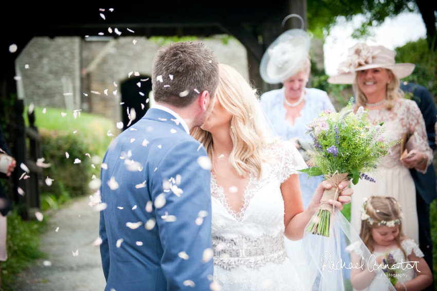 Professional colour photograph of Holly and Chris' Cornwall beach wedding at Palhawn Fort by Rachael Connerton Photography