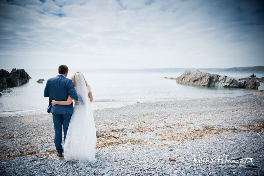 Professional colour photograph of Holly and Chris' Cornwall beach wedding at Palhawn Fort by Rachael Connerton Photography